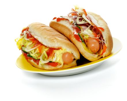 Two Hot Dogs on Yellow Plate isolated on white background