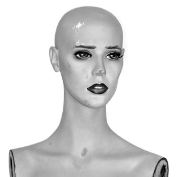 Weathered plastic mannequin doll head. Black and white.