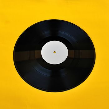 Vinyl record white label promo on yellow background. Music and audio.