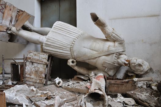 ATHENS - FEBRUARY 3: Broken statue gigantic figure ancient god in the abandoned vandalized studio of sculptor Nikolaos Pavlopoulos in Athens Greece, February 3, 2012.