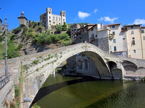 Village with castle and roman stone bridge