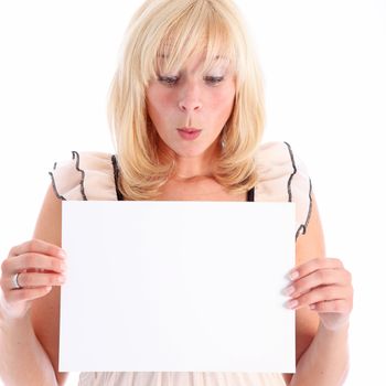 Woman looking at blank white sign that she is holding for your text in admiration and exclaming 'ooh' 
