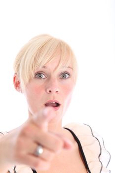 Woman pointing her finger at the camera with look of amazement on her face with focus to her head 