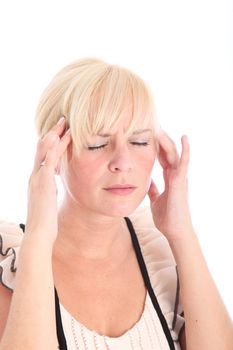 Woman suffering from a migraine headache rubbing her temples with her fingertips to relieve the throbbing 