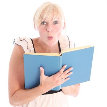 Excited blonde woman reading a blue book - isolated on white 