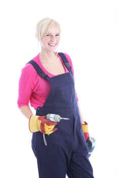 Studio shot of smiling female worker with a drill isolated on white 