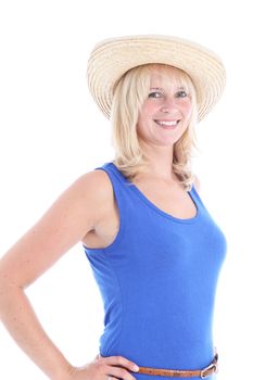 Smiling blonde woman with a straw hat posing on white background 