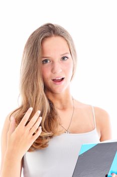 Young girl looking up with a look of surprise after reading something unexpected in the book she is holding isolated on white Young girl looking up with a look of surprise after reading something unexpected in the book she is holding isolated on white