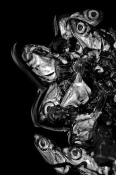 Pile of cut off fish heads. Black and white.