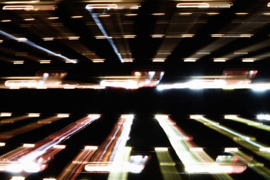 Sunlight passing through closed window shutter. Speed of light long exposure.