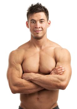 Portrait of a handsome young man with great physique posing against white background
