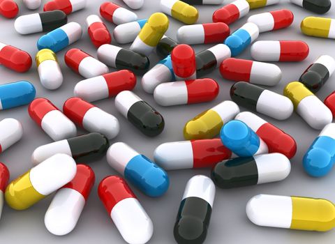 Concept of many colorful pills in red, blue, yellow, black, colors. Scene rendered on white background.