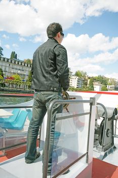 Boating in Lugano - Man driving a boat on a lake in Lugano, Switzerland