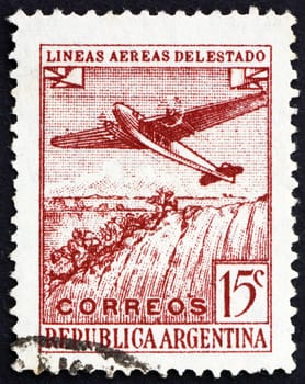 ARGENTINA - CIRCA 1946: a stamp printed in the Argentina shows Plane over Iguazu Falls, circa 1946