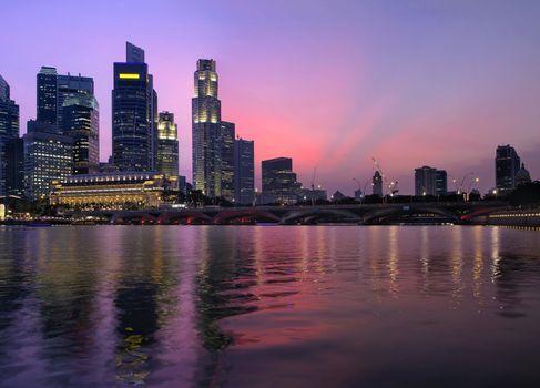 Singapore Central Business District Skyline Along River and Esplanade Bridge at Twilight