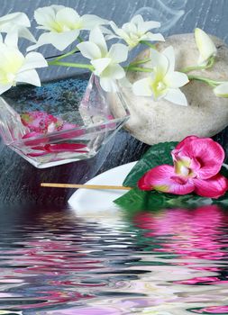 spa concept with zen stones, sea salt, and orchid