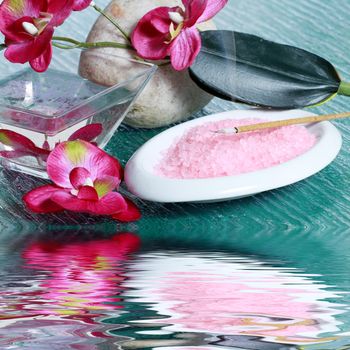 spa concept with zen stones, sea salt, and orchid