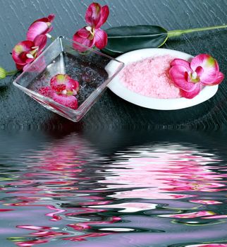 spa concept with zen stones, sea salt, and orchid