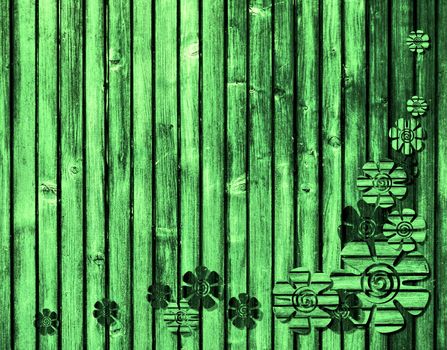 green wooden background with flowers