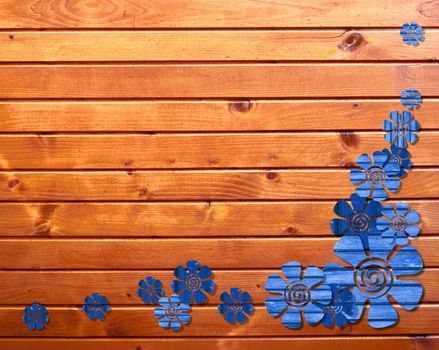 wooden background with blue flowers