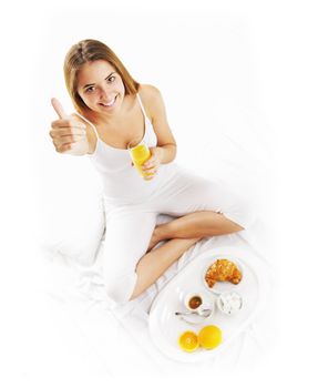 Woman waking up to breakfast in bed