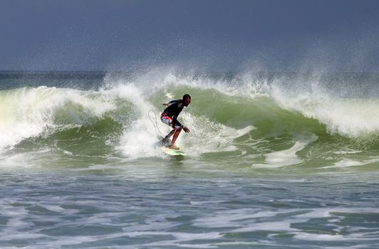 Man-surfer in ocean. Bali. Indonesia