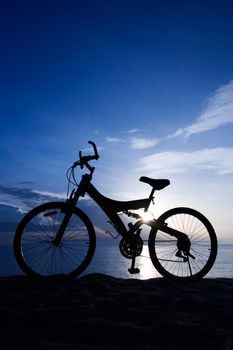Silhouette of a Bike on the Beach