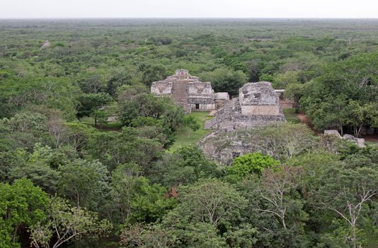 The Oval Palace and The Twins shot from the top of the Acropolis in the Mayan ruins of Ek' Balam.  The name Ek' Balam means 'Black Jaguar'. It is located in the Yucatan Peninsula, Mexico.
