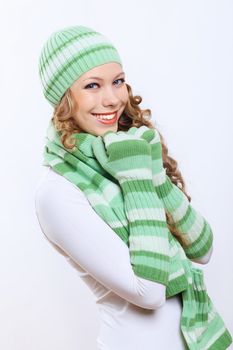 Young pretty woman in warm winter hat and scarf