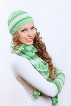 Young pretty woman in warm winter hat and scarf