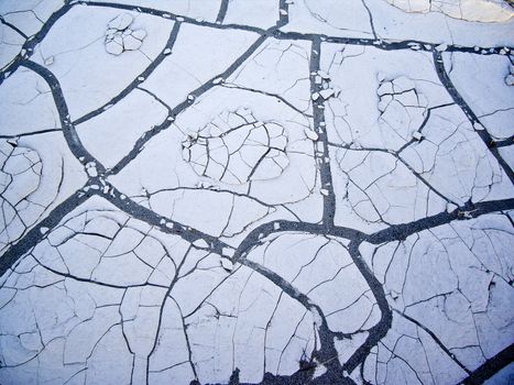 Sun-baked earth at Death Valley cracks and flakes