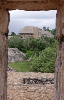 The Acropolis and several other structures in the Mayan ruins of Ek' Balam.  It is the largest structure at the site.  The name Ek' Balam means 'Black Jaguar'. It is located in the Yucatan Peninsula, Mexico.
