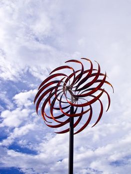 Whirlwind art against cloudy sky