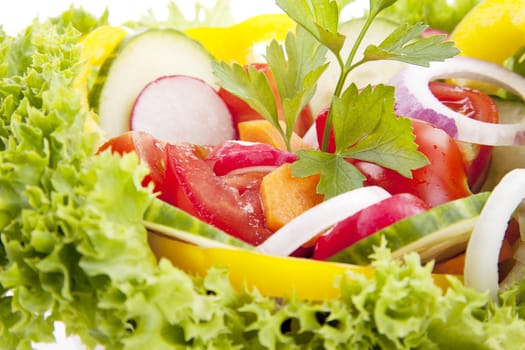 fresh tasty healthy salad with different vegetables isolated on white background