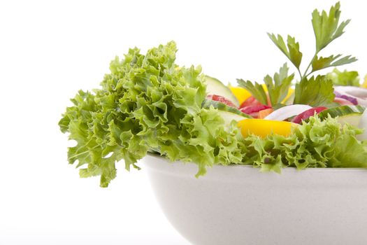 fresh tasty healthy salad with different vegetables isolated on white background