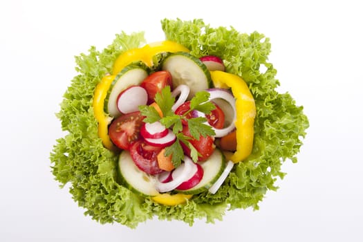 fresh tasty healthy salad with different vegetables isolated on white background