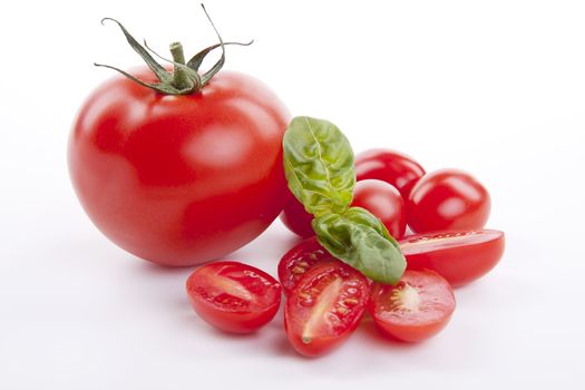 fresh red tomatoes with balsamic and oilve oil isolated on white background