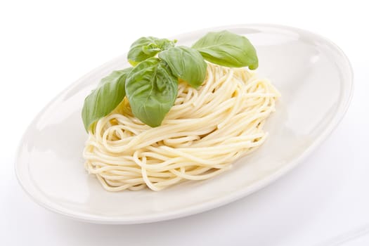 fresh delicious pasta with basil isolated on white background