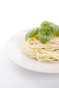 fresh delicious pasta with basil isolated on white background