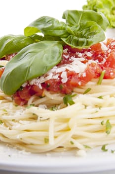 tatsty fresh spaghetti with tomato sauce and parmesan isolated on white background