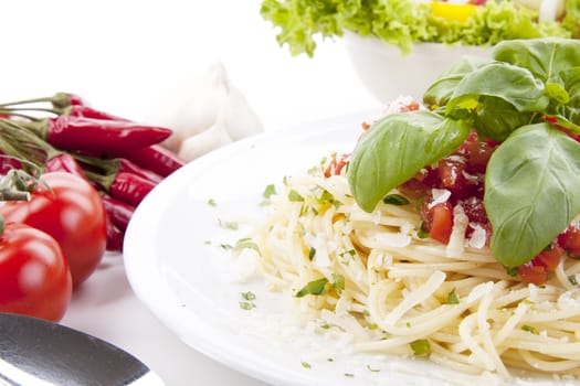 tatsty fresh spaghetti with tomato sauce and parmesan isolated on white background