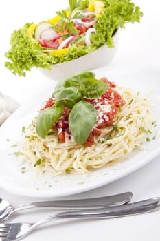 tatsty fresh spaghetti with tomato sauce and parmesan isolated on white background