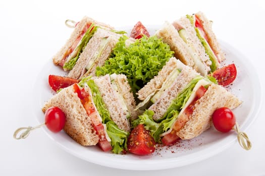 fresh tasty club sandwich with lettuce cheese ham and toast isolated on white background