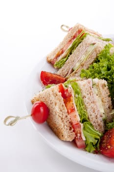 fresh tasty club sandwich with lettuce cheese ham and toast isolated on white background