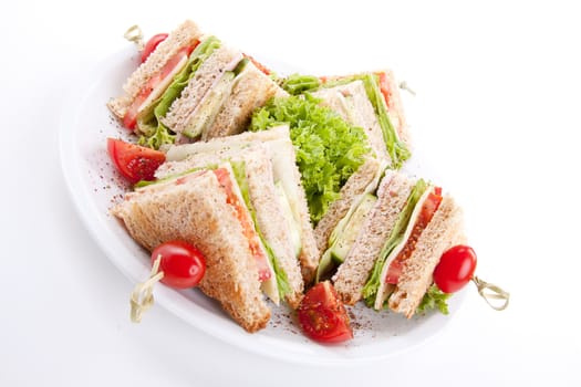 fresh tasty club sandwich with lettuce cheese ham and toast isolated on white background