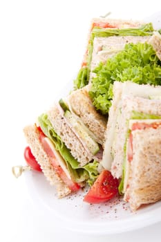 fresh tasty club sandwich with lettuce cheese ham and toast isolated on white background