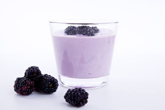 fresh tasty blackberry yoghurt shake dessert isolated on white background