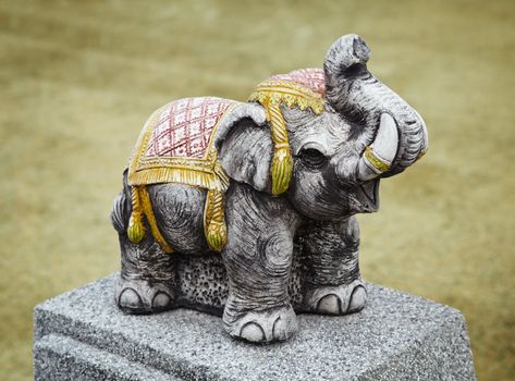 The concrete sculpture of an old Indian elephant