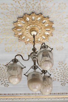 Antique lamp on the ceiling.