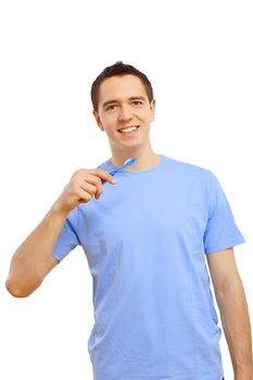 Young man in blue shirt brushing his teeth